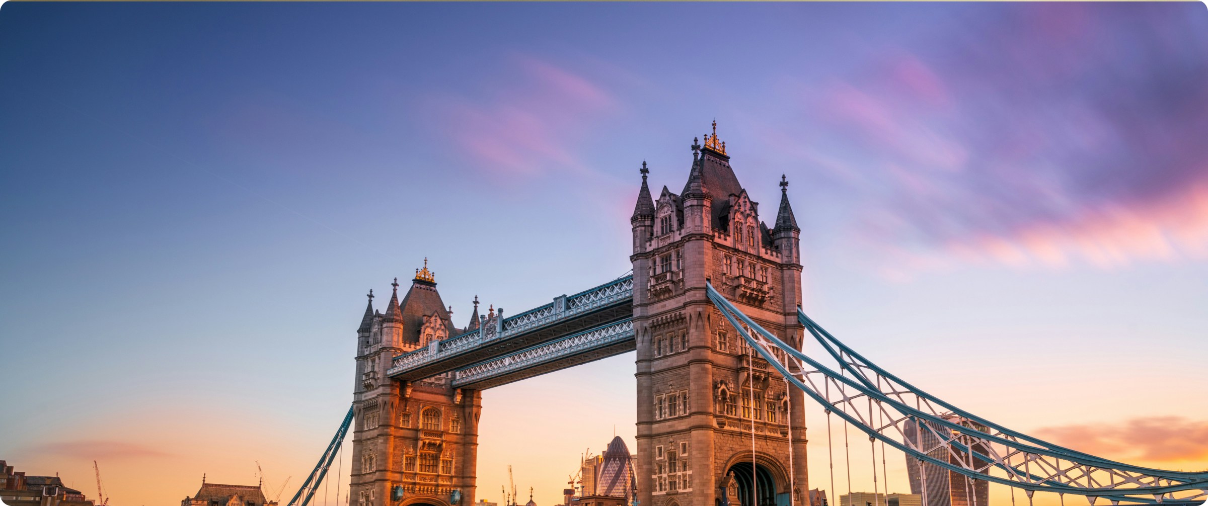 Tower Bridge over River Thames in London at sunset.