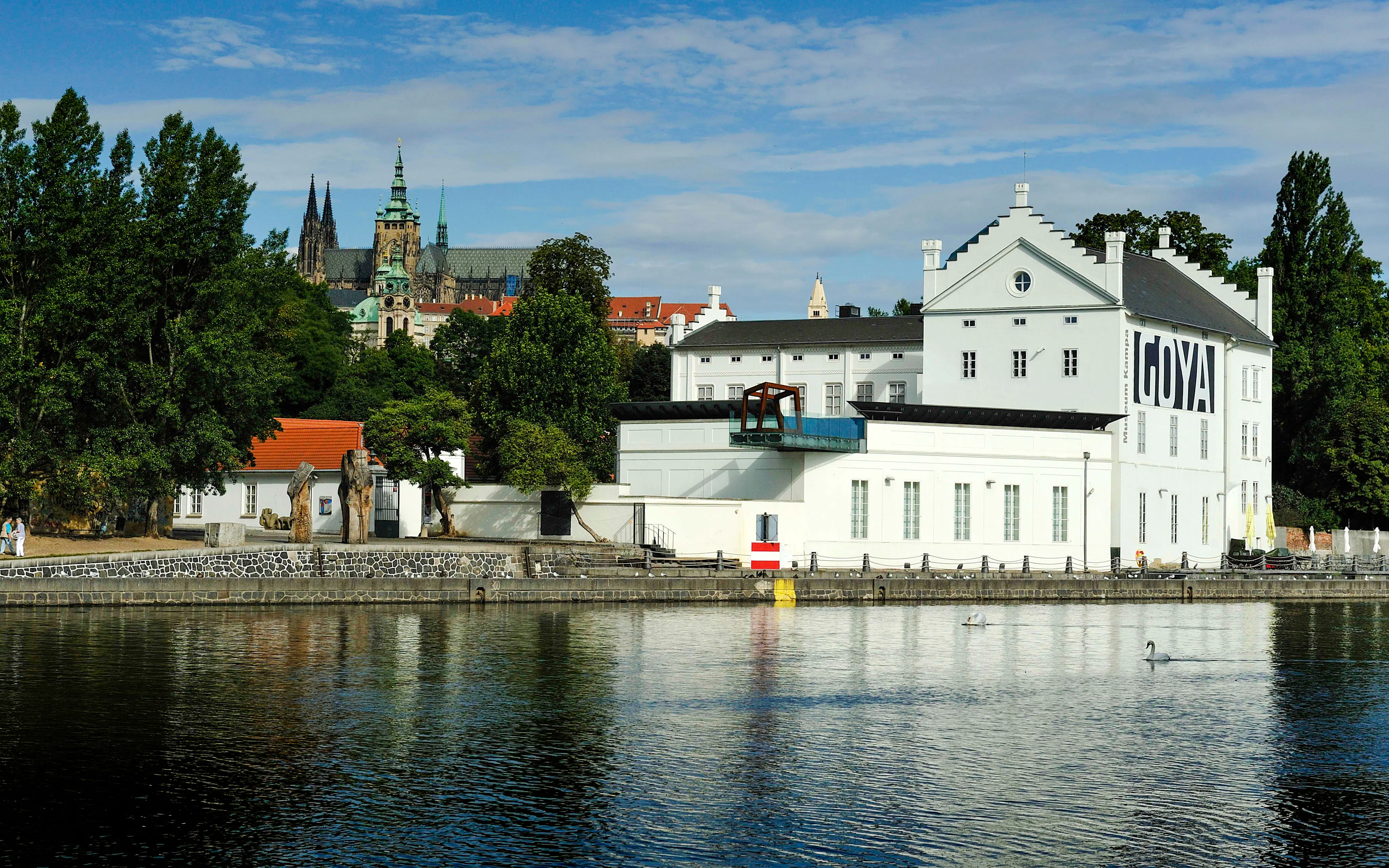Museum Kampa by the Vltava River with Prague Castle in the background.