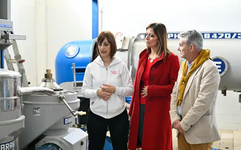 Tour group learning about olive oil production at a mill in Dolianova, Cagliari.