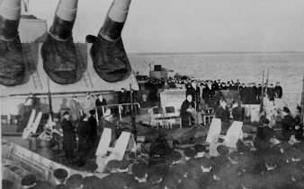 Battleship IOWA deck with historical gathering during President's tour.