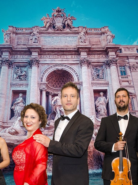 Opera musicians in front of Trevi Fountain at Palazzo Poli, Rome.