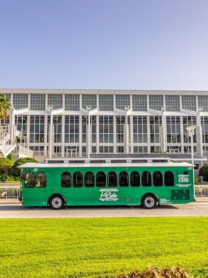 Green trolley in front of Orange County Convention Center, Orlando.