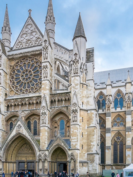 Westminster Abbey exterior with tourists, London.