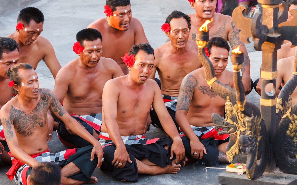 Men performing the Uluwatu Kecak & Fire Dance in Bali, Indonesia.