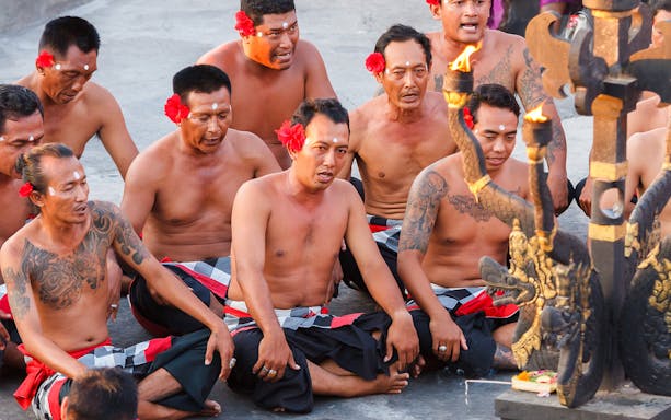 Men performing the Uluwatu Kecak & Fire Dance in Bali, Indonesia.