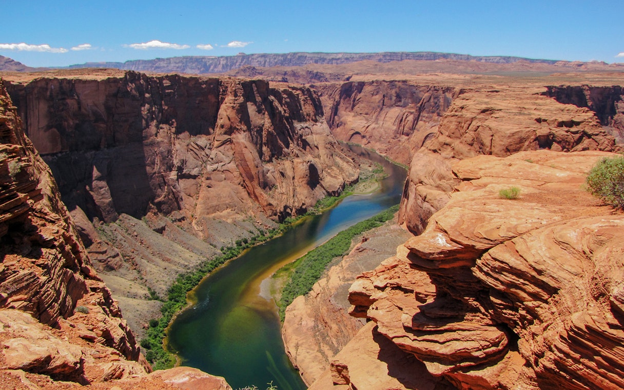 Colorado River winding through the rocky cliffs at the start of the Grand Canyon.