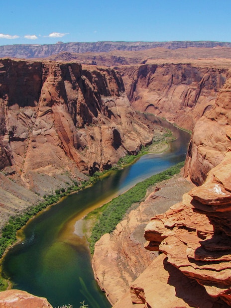Colorado River winding through the rocky cliffs at the start of the Grand Canyon.
