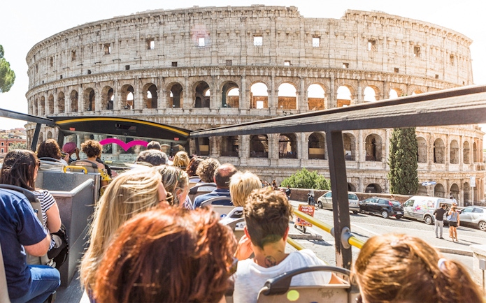 Tourists on a bus near the Colosseum in Rome.