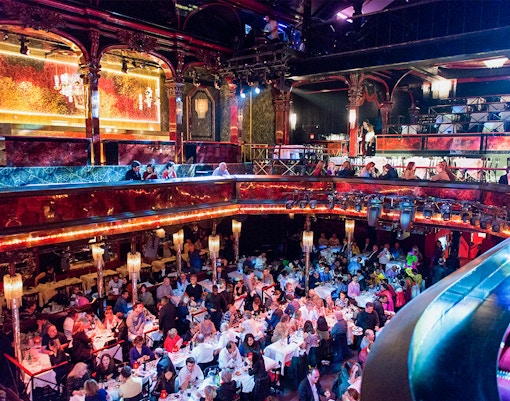 Paradis Latin cabaret show with dinner setup, Paris, Christmas Eve special.