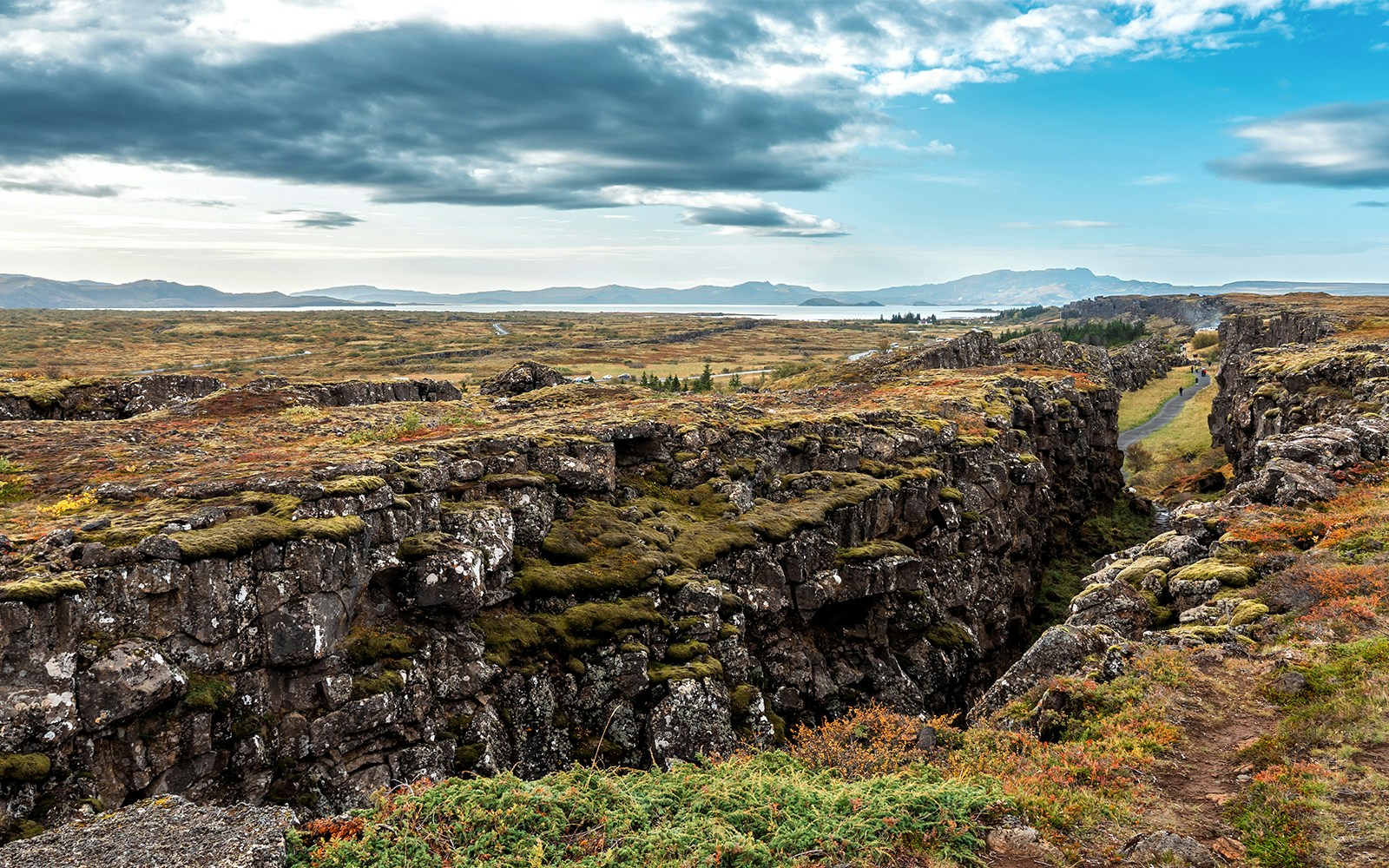 Almannagja fault in Thingvellir National Park, Iceland, with tourists exploring the rift.