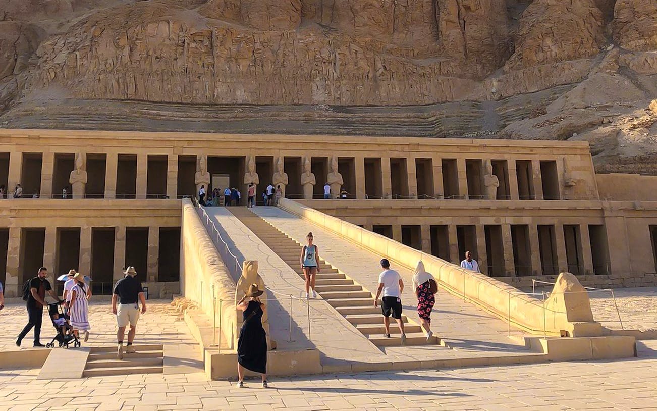 Tourists exploring the Temple of Hatshepsut in the Valley of the Kings, Egypt.
