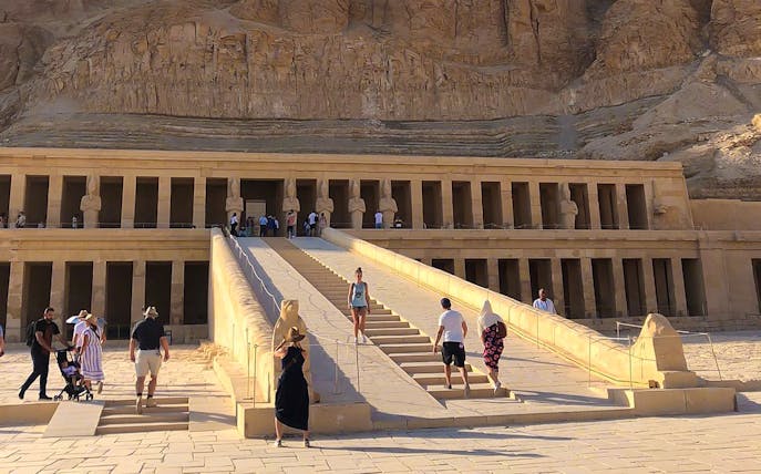 Tourists exploring the Temple of Hatshepsut in the Valley of the Kings, Egypt.