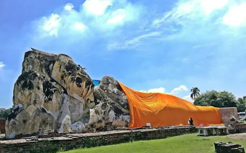 Reclining Buddha statue draped in orange cloth at Ayutthaya, Thailand.