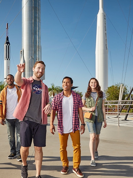 Visitors walking among rockets at Kennedy Space Center, Florida.