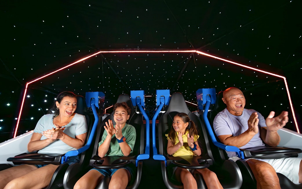 Family enjoying the Galacticoaster ride at LEGOLAND California Resort.