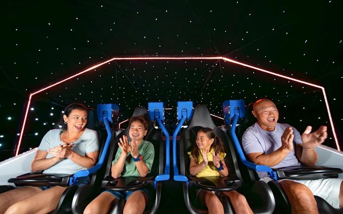 Family enjoying the Galacticoaster ride at LEGOLAND California Resort.