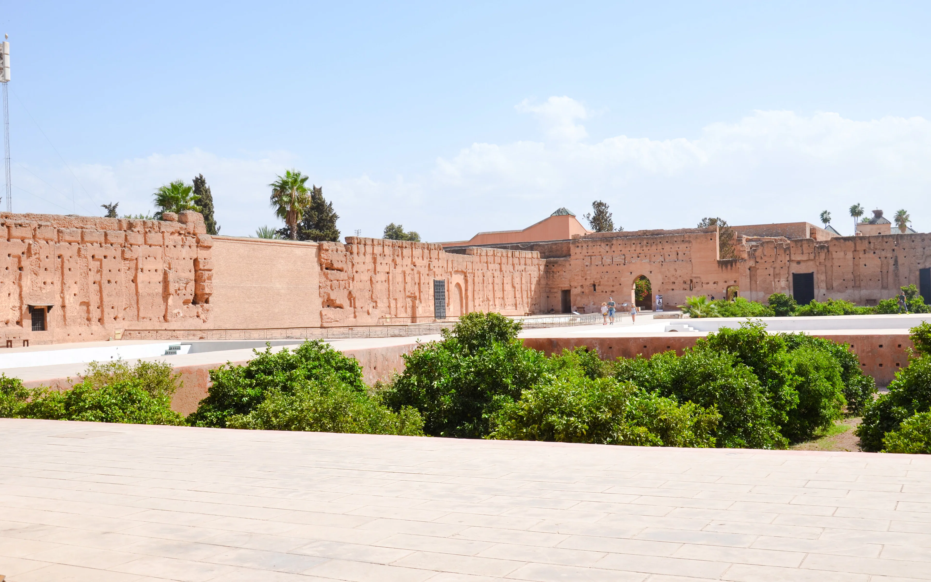Palais El Badi ruins with orange walls and gardens in Marrakech.