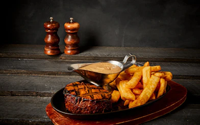 Grilled fillet with fries and sauce on Tomb of the Pharaoh Sunset tour.