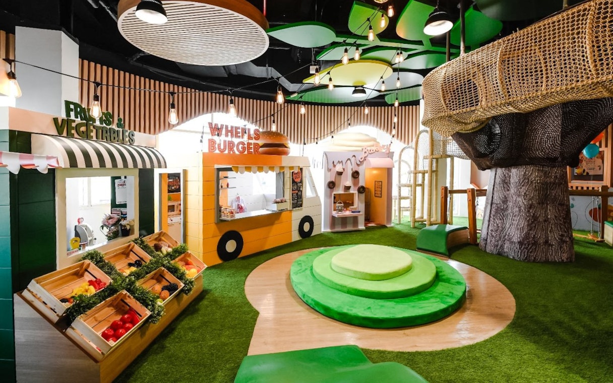 Interior of Orange Wheels edutainment center with play areas, Global Village, Dubai.