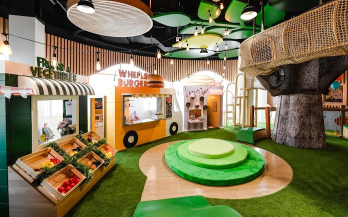 Interior of Orange Wheels edutainment center with play areas, Global Village, Dubai.