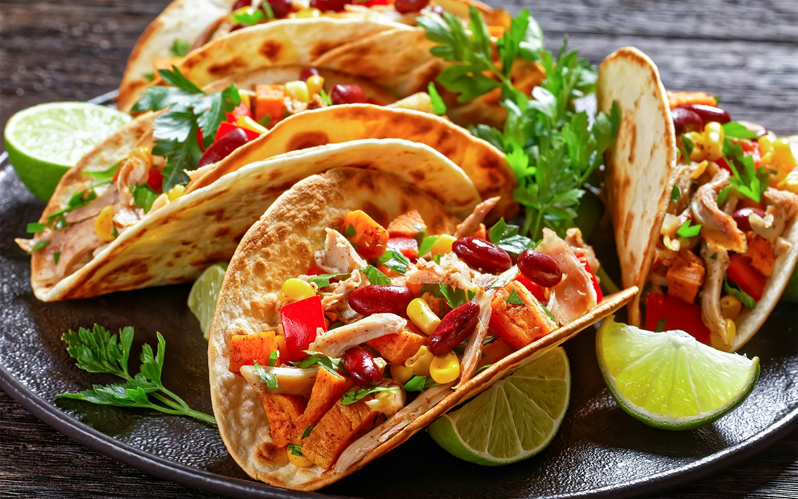 PortAventura Hotels exterior view with palm trees and pool in Salou, Spain.
