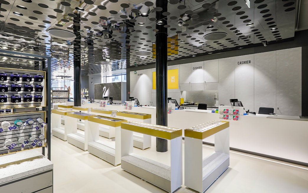 Swarovski House interior in Vienna with display counters and gift items.