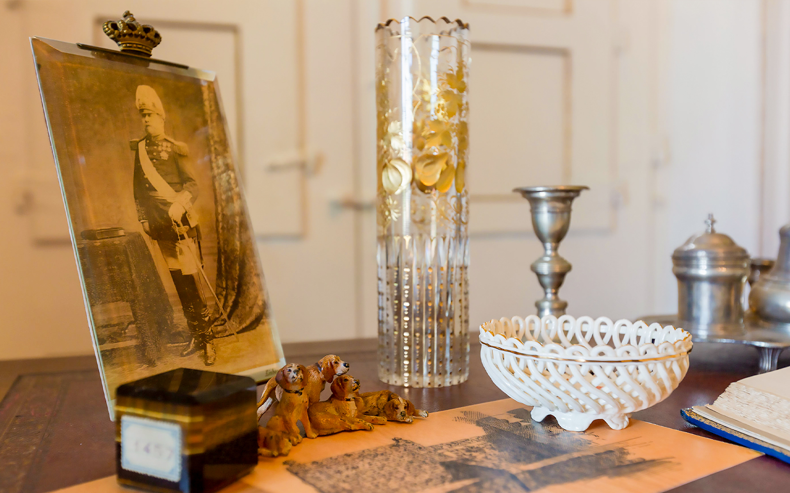 Artifacts in Queen Maria Pia's Chambers, National Palace of Sintra, including a photograph and decorative items.