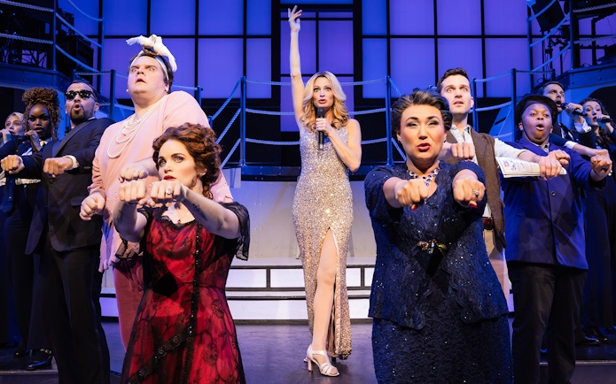 Performers on stage during a scene from the musical Titanique.