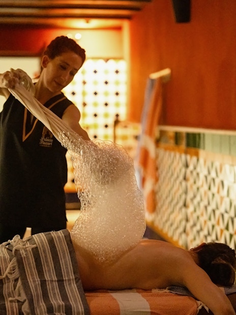Visitors enjoying a traditional Hammam bubble bath in Granada.