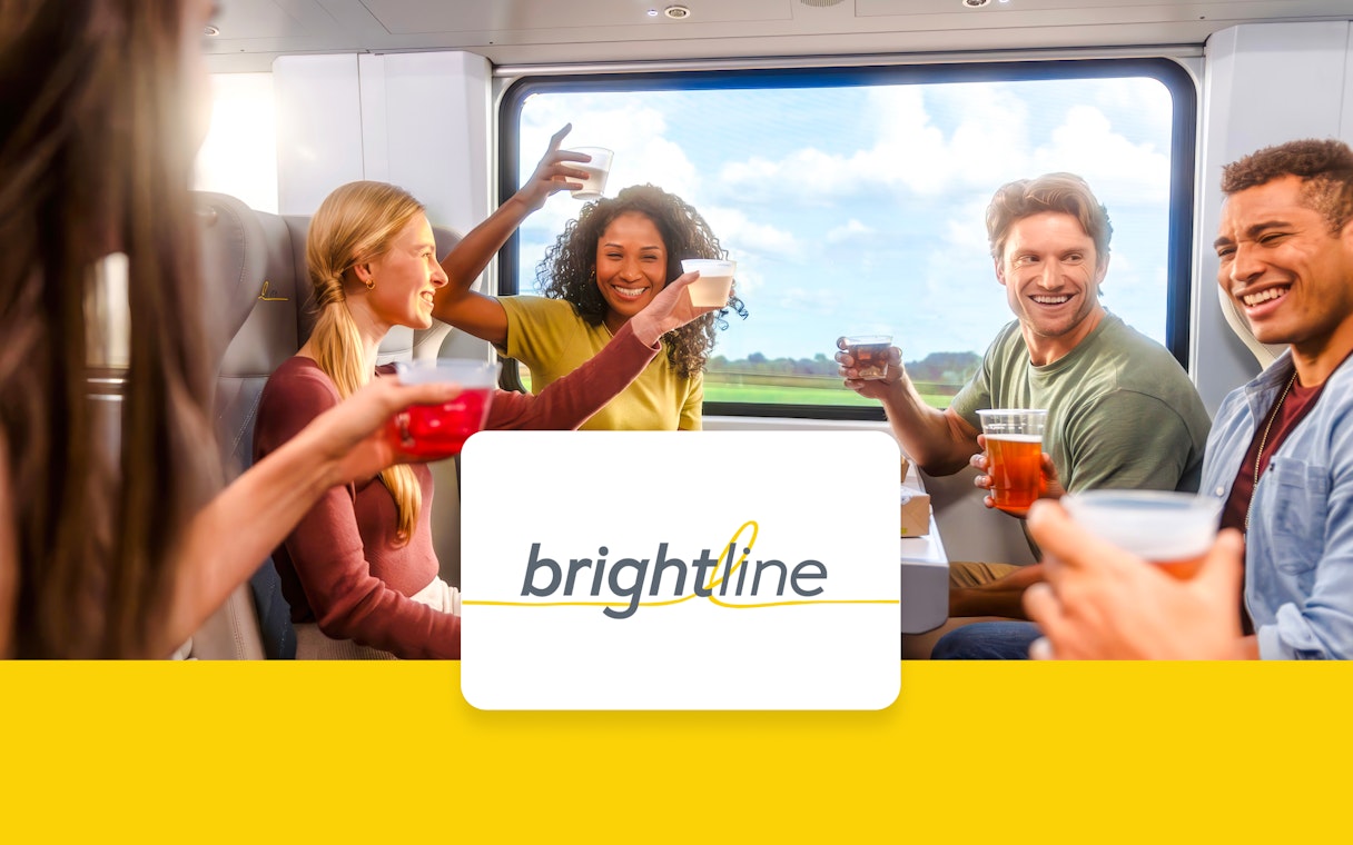 Passengers enjoying drinks on the Brightline train from Miami to Orlando.