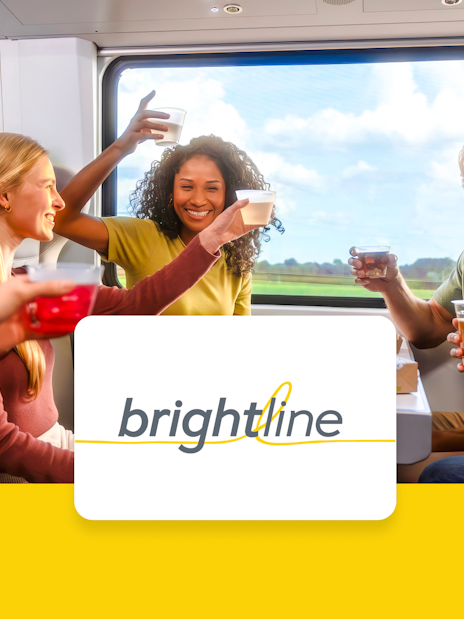 Passengers enjoying drinks on the Brightline train from Miami to Orlando.