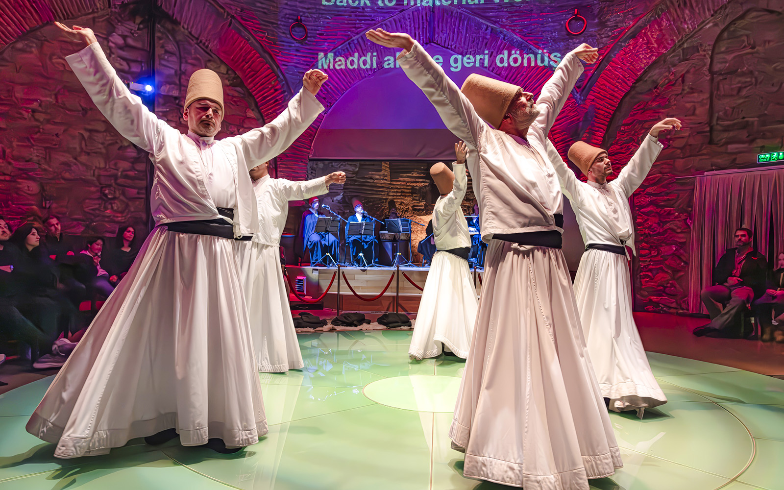 Whirling dervishes performing at Hodjapasha Cultural Center in Istanbul.