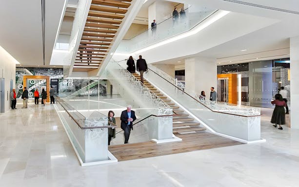 Visitors exploring the modern interior of the Museum of the Bible in Washington, D.C.