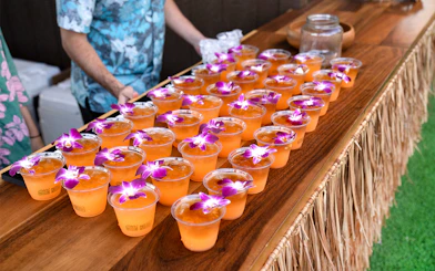 Tropical drinks with orchids at Mauka Warriors Luau.