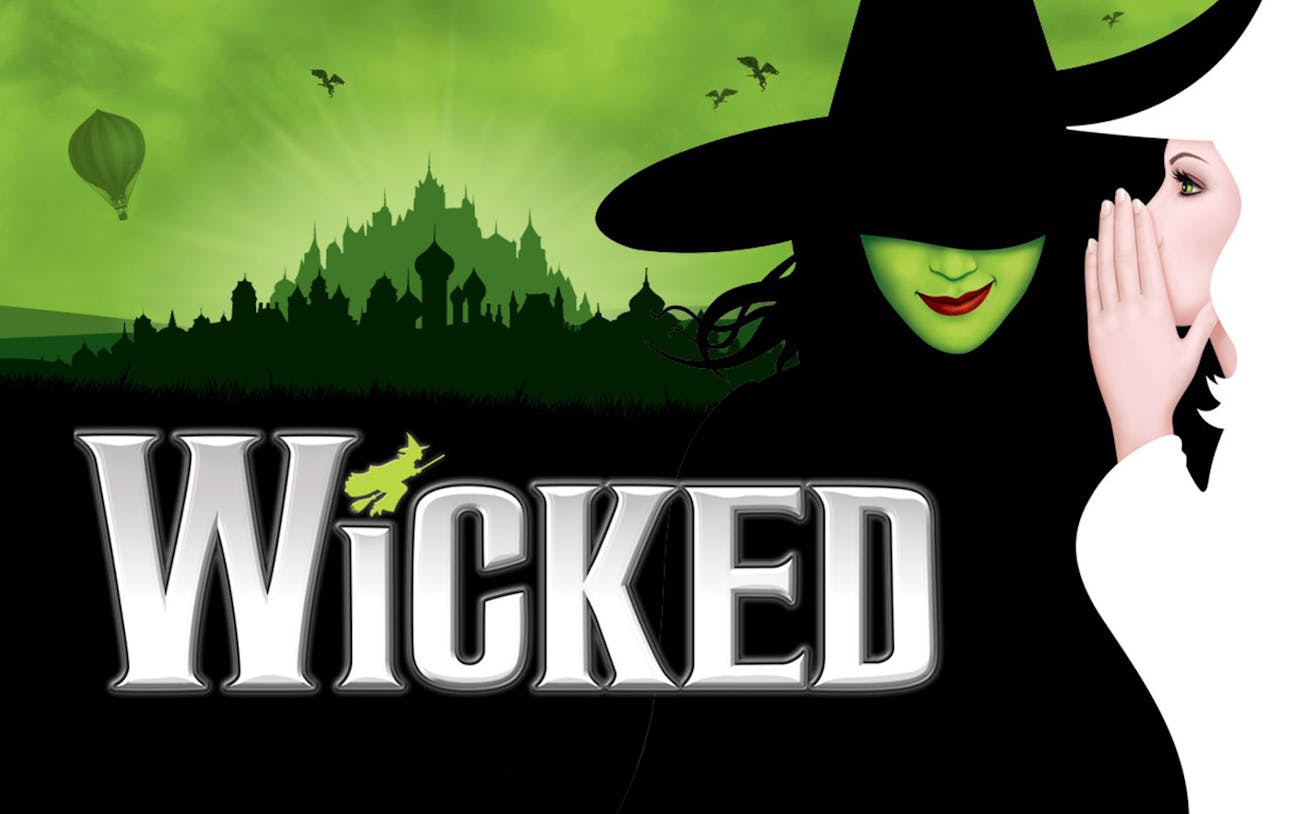 Wicked musical poster with green witch and city skyline backdrop