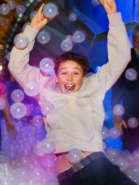 Person enjoying bubble room experience at The TUBE in Copenhagen.