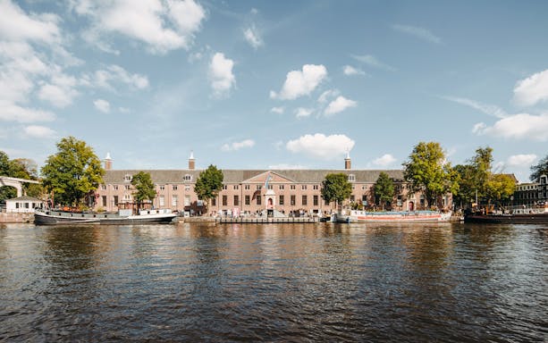H’ART Museum exterior along the canal in Amsterdam, Netherlands.