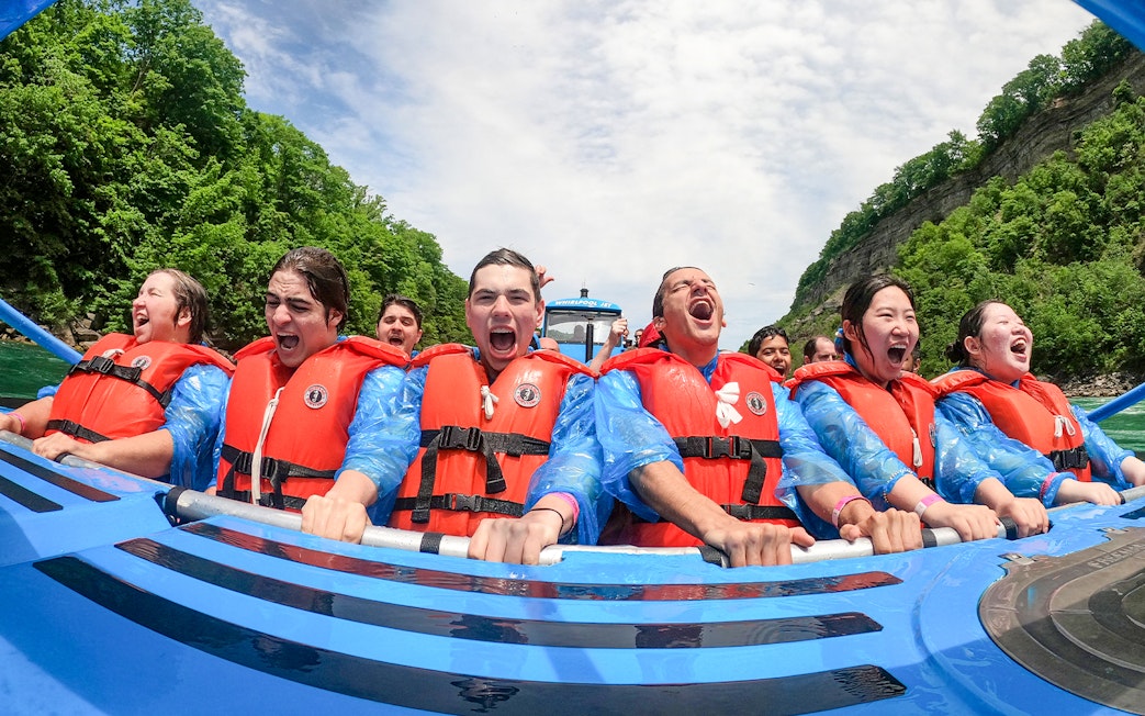 Guests enjoying a thrilling Whirlpool Jet Boat Tour in Niagara Gorge, Canada.