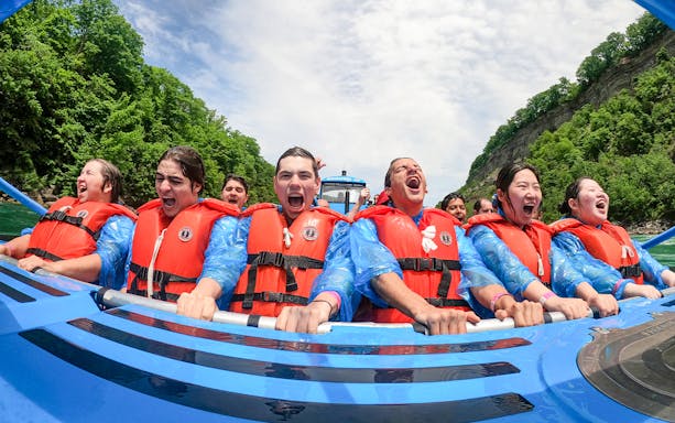 Guests enjoying a thrilling Whirlpool Jet Boat Tour in Niagara Gorge, Canada.