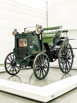 Historic green carriage on display at the National Coach Museum, Lisbon.