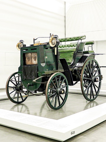 Historic green carriage on display at the National Coach Museum, Lisbon.