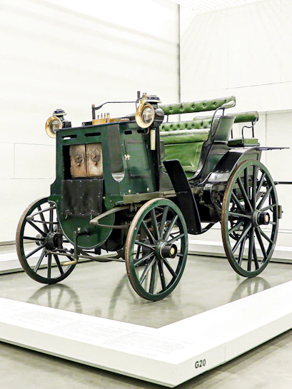 Historic green carriage on display at the National Coach Museum, Lisbon.