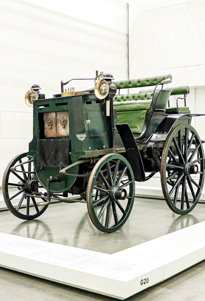 Historic green carriage on display at the National Coach Museum, Lisbon.