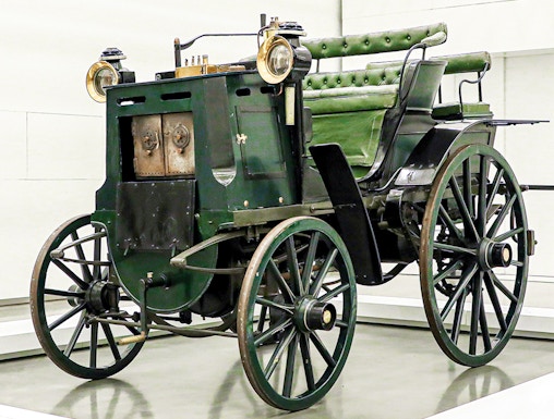 Historic green carriage on display at the National Coach Museum, Lisbon.