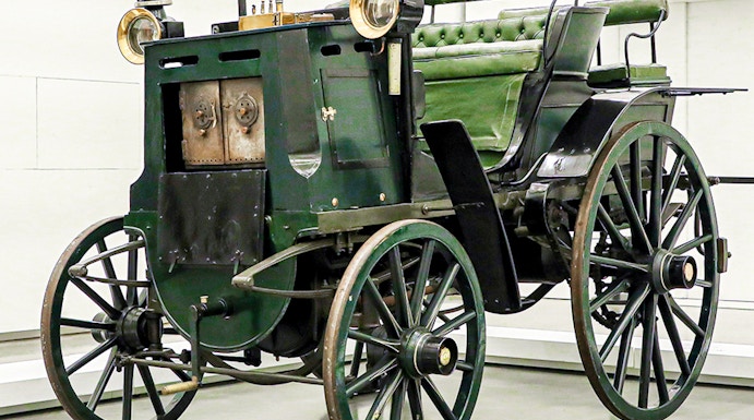 Historic green carriage on display at the National Coach Museum, Lisbon.