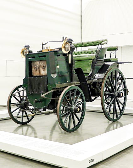 Historic green carriage on display at the National Coach Museum, Lisbon.