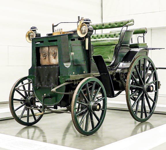 Historic green carriage on display at the National Coach Museum, Lisbon.