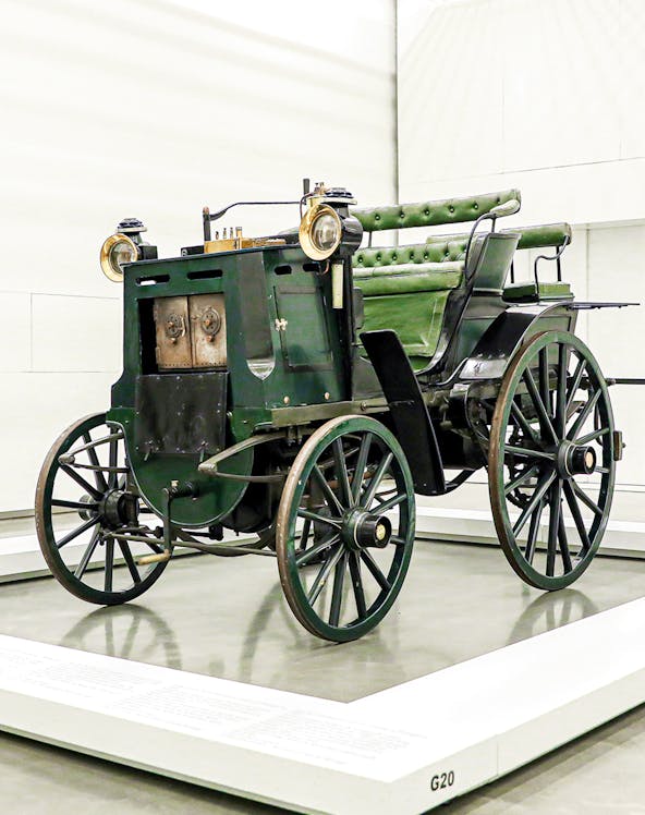 Historic green carriage on display at the National Coach Museum, Lisbon.