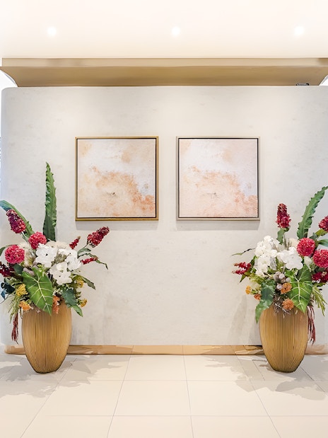 Floral arrangements and abstract art in Miracle Lounge, Bangkok Airport, Thailand.