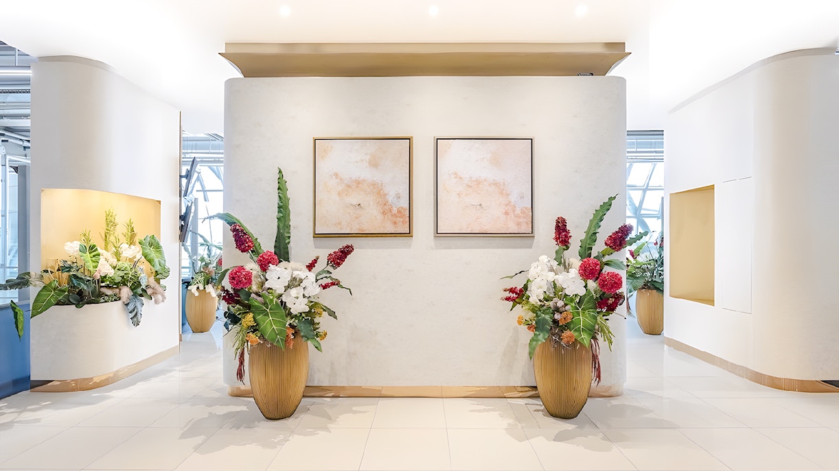 Floral arrangements and abstract art in Miracle Lounge, Bangkok Airport, Thailand.